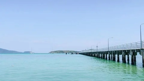 Timelapse beach concrete pier over turquoise clear blue sea in Phuket islan.. Stock Footage 320633655