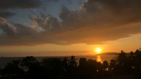 Timelapse at the beach during sunset - fast moving clouds Stock Footage 194433762