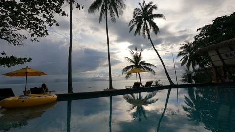 Timelapse at the beach - fast moving clouds mirror in the pool Stock Footage 194446058