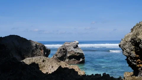 Timelapse of beach with sea waves splashing and rocky coast, Bali, Indonesia Stock Footage 140276684