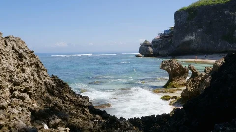 Timelapse of beach with sea waves splashing on rocky coast, Bali, Indonesia Stock Footage 140276804