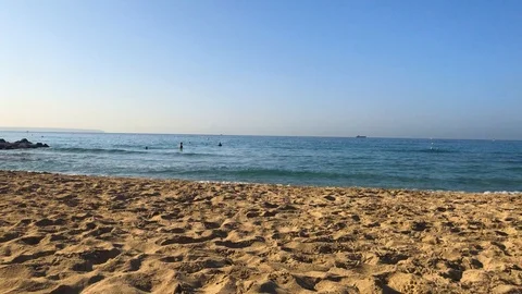 Timelapse of a beach where some baths Stock Footage 122356318