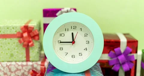 Timelapse of beautiful Alarm Clock on gift box Background, Alarm Clock Face in T Stock Footage 220645249