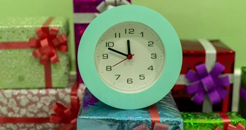 Timelapse of beautiful Alarm Clock on gift box Background, Alarm Clock Face in T Stock Footage 220646996