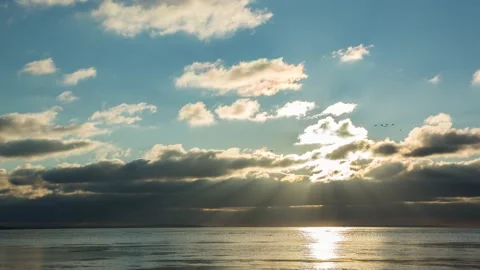 Timelapse beautiful blue sky at sunset with fast clouds near the river, wint Stock Footage 168940692