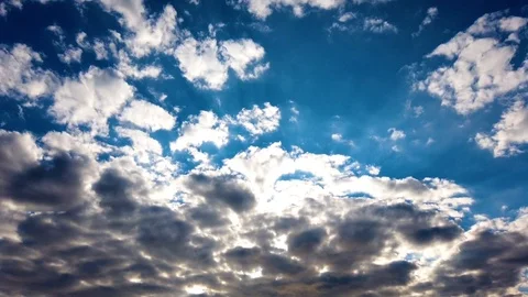 Timelapse. Beautiful clouds float quickly against the blue sky Stock Footage 123601486