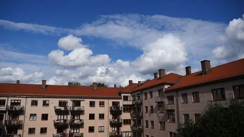 Timelapse - beautiful clouds over cozy building from the 1930's Stock Footage 158761977