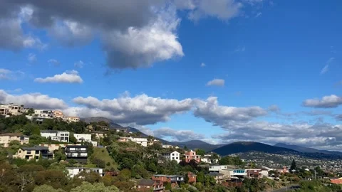 Timelapse beautiful clouds rolling over mount wellington and hills of Hobart 動画素材 237700034