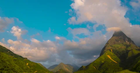 Timelapse Beautiful landscape mountain green field grass meadow white cloud blue Stock Footage 160793253
