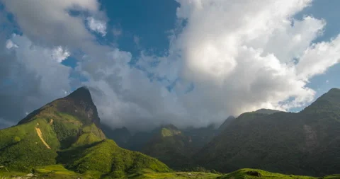 Timelapse Beautiful landscape mountain green field grass meadow white cloud blue Stock-Footage 218412202