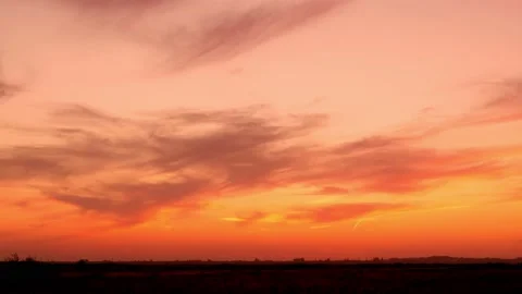 Timelapse Beautiful Orange Red Sky with Light Cirrus Clouds at Sunset in the Fie Stock Footage 172197676