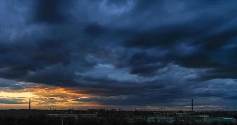 Timelapse of a beautiful sunset with clouds backlit by the sun Stock-Footage 129567495