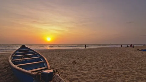 Timelapse of beautiful sunset on an Indian beach with boat in foreground Stock Footage 78020455