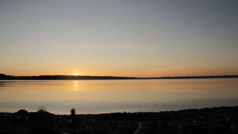 Timelapse - Beautiful sunset by the lake Video stock 129733947