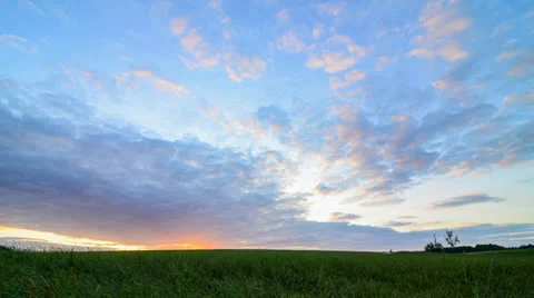 Timelapse - Beautiful Sunset over Field Stock Footage 22983827