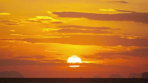 Timelapse of Beautiful sunset sun Close Up Big red hot Sun in golden hour Above  Stock Footage 167045402