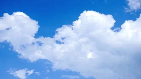 Timelapse beautiful thick fluffy clouds. Amazing soft white clouds moving clear Stock Footage 336568741