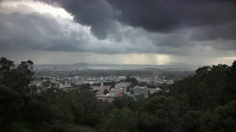Timelapse of Berkeley Cityscape with Moving Clouds and Heavy Rain Stock Footage 219836127