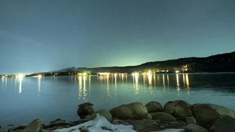 Timelapse of Big Bear Lake Freezing Overnight Near City Lights and Passing Cars Stock Footage 272838909