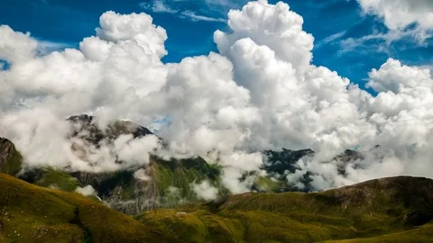 Timelapse of big clouds on mountain top Stock Footage 80954599