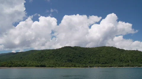 Timelapse of big White Cumulus Clouds forming over tropical coast Video stock 557632