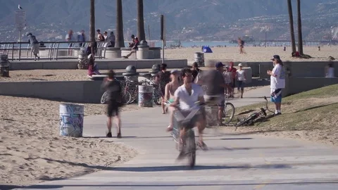Timelapse of bikers skaters bladers pedestrians on venice beach Stock Footage 84162175