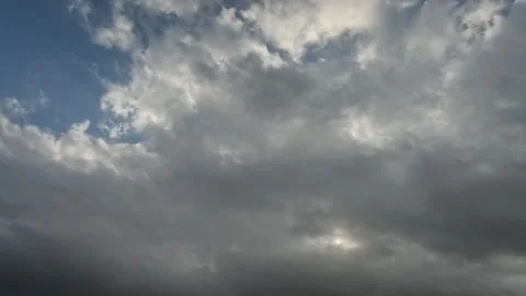 Timelapse of black and white clouds in the blue sky Stock Footage 321282171