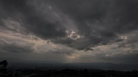 Timelapse of black clouds with dramatic sunlight Stock Footage 306671048