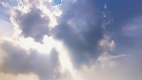 Timelapse of black clouds over the sun rays coming through the clouds Stock Footage 114733678