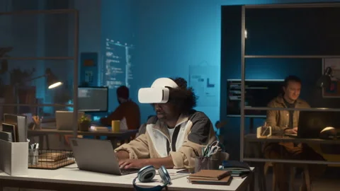 Timelapse of Black Male Programmer Developing VR Applications at Work 動画素材 279621880