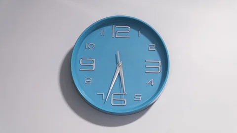 Timelapse of a blue clock on a white background. Stock Footage 89677907