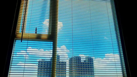 Timelapse of blue sky and clouds seen through apartment window Stock Footage 330571984