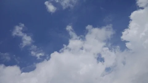 Timelapse of blue sky, clouds and moon (4K Timelapse) Stock Footage 72986321