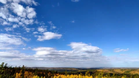 Timelapse blue sky with clouds over hilly forest valley in autumn. beauty nature Stock Footage 302547363