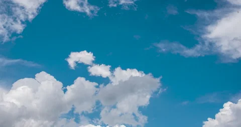 Timelapse Blue sky fluffy white clouds on summer season bright clear skyline wit Stock Footage 247596704