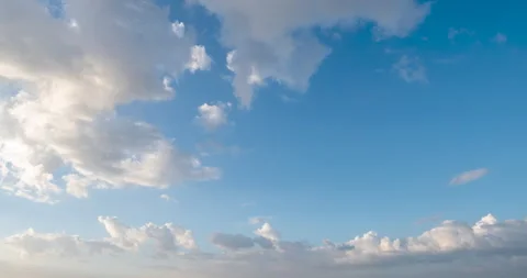 Timelapse Blue sky fluffy white clouds on summer season bright clear skyline 動画素材 262502619
