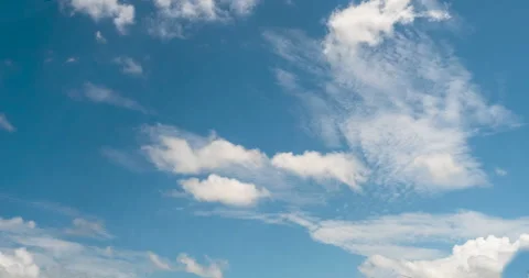 Timelapse Blue sky fluffy white clouds on summer season bright clear skyline Видео 266769461