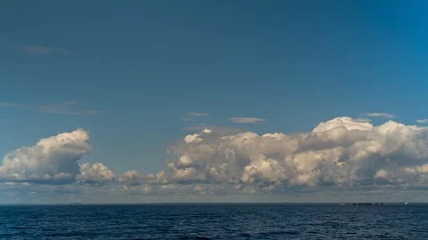Timelapse in the blue sky over the Gulf of Finland flying clouds. Stock Footage 114978588