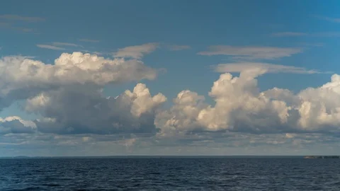 Timelapse in the blue sky over the Gulf of Finland flying clouds. Stock Footage 114978847