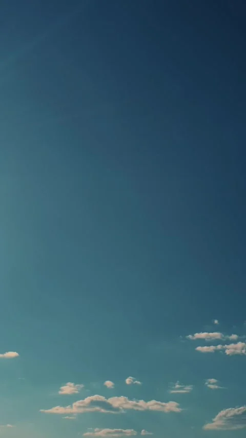 Timelapse, blue sky, running clouds, bright day sun Video stock 315754278