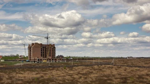 Timelapse of blue sky with white clouds above spring field. Video stock 129600245