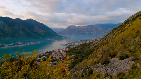 Timelapse: boat moving through Kotor Bay under fast evening clouds Stock Footage 341298389