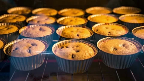 Timelapse of bread and cake dough baking in oven. Bakery rising in oven. Baking Stock-Footage 336576458