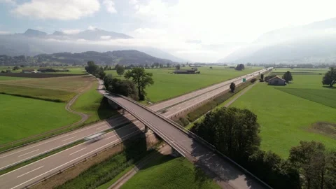 Timelapse bridge over a highway with fast driving cars in beautiful Switzerland Stock Footage 162622601