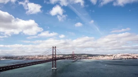 Timelapse of bridge with Tagus river and boats Stock Footage 84111152