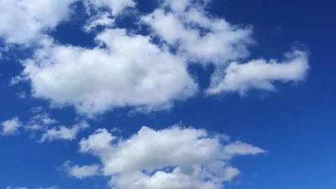 Timelapse bright blue sky with flying white clouds Stock Footage 134693857
