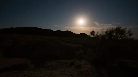 Timelapse of a bright moon on background of clouds Video stock 250551231
