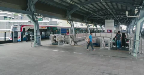 Timelapse on the BTS sky train platform with many passenger. southeast asia l Stock-Footage 201709486
