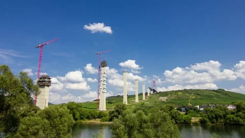Timelapse building a modern bridge over a river Stock-Footage 204139312