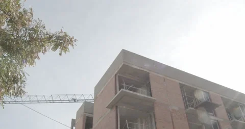 Timelapse building with moving crane and clouds 4K Stock Footage 165655665
